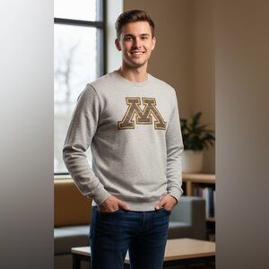 47 light gray longsleeved, crewneck T-shirt. Large “M” in front, distressed, L